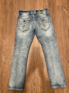 Rock Revival Men's Light Blue Washed Jeans with Embroidered Back Pockets